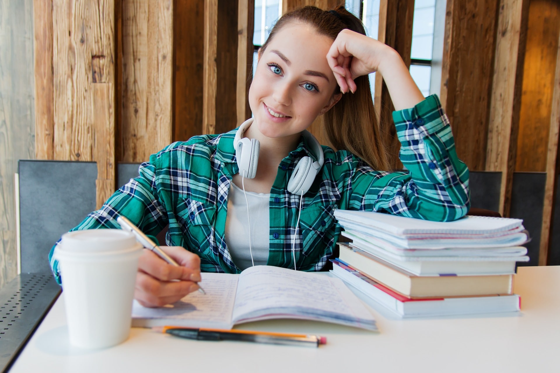 Woman studying with headphones