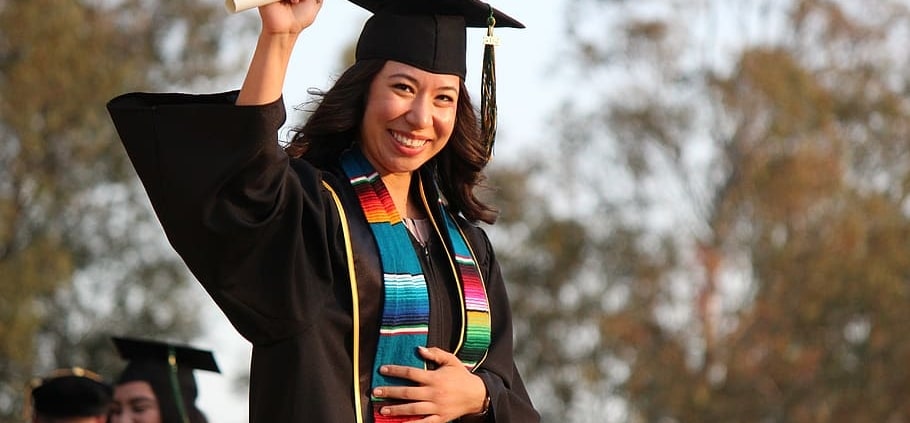 Female graduate with diploma