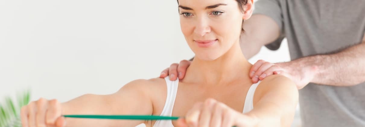 Female patient working with a physical therapist
