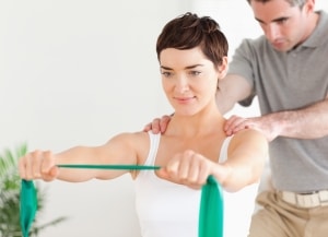 Female patient working with a physical therapist