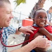 Doctor giving checkups to underprivileged kids