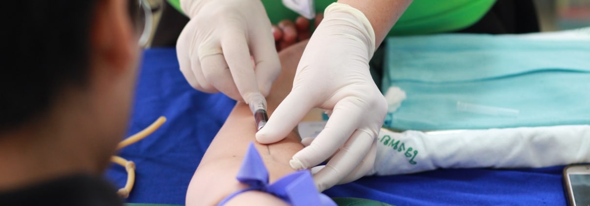 Medical professional drawing blood