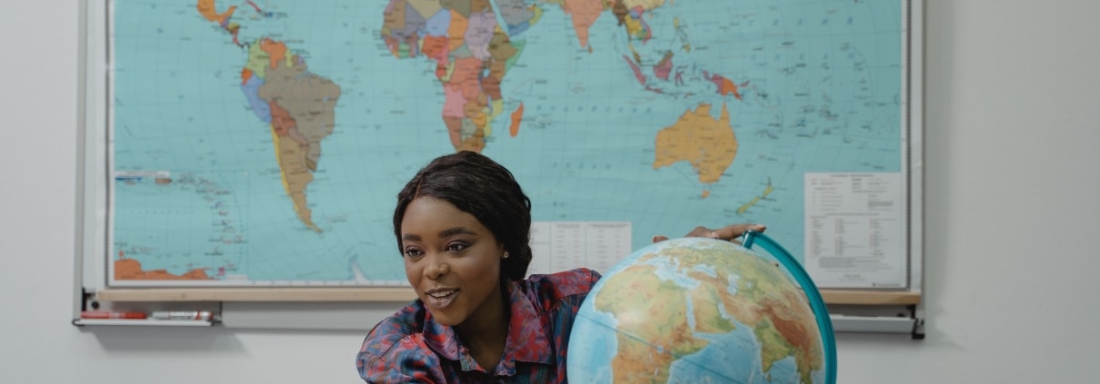 African-American woman with a globe