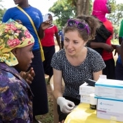 Volunteer medical staff assisting a woman