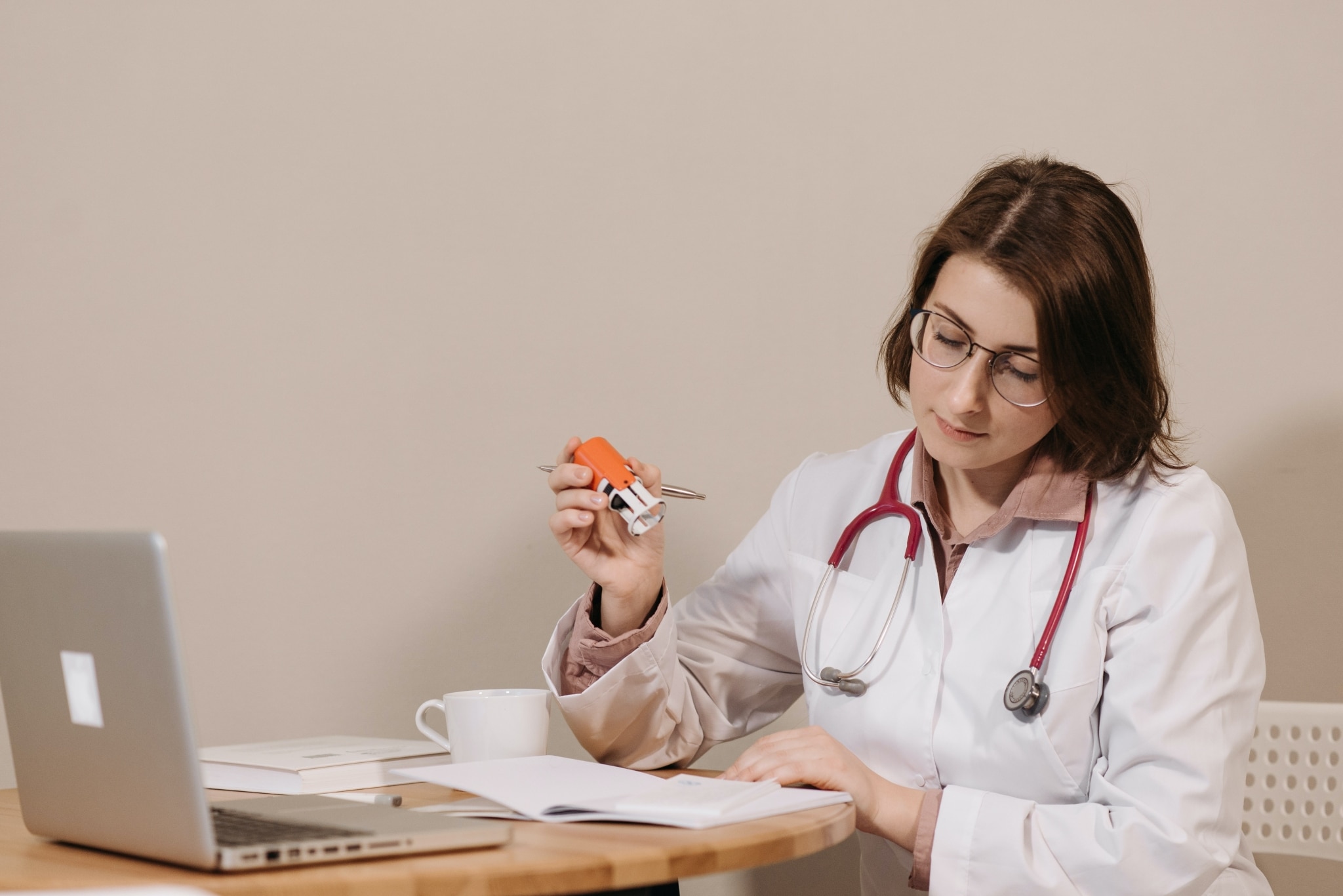 Medical professional stamping paperwork