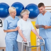 Physical therapy team with a patient