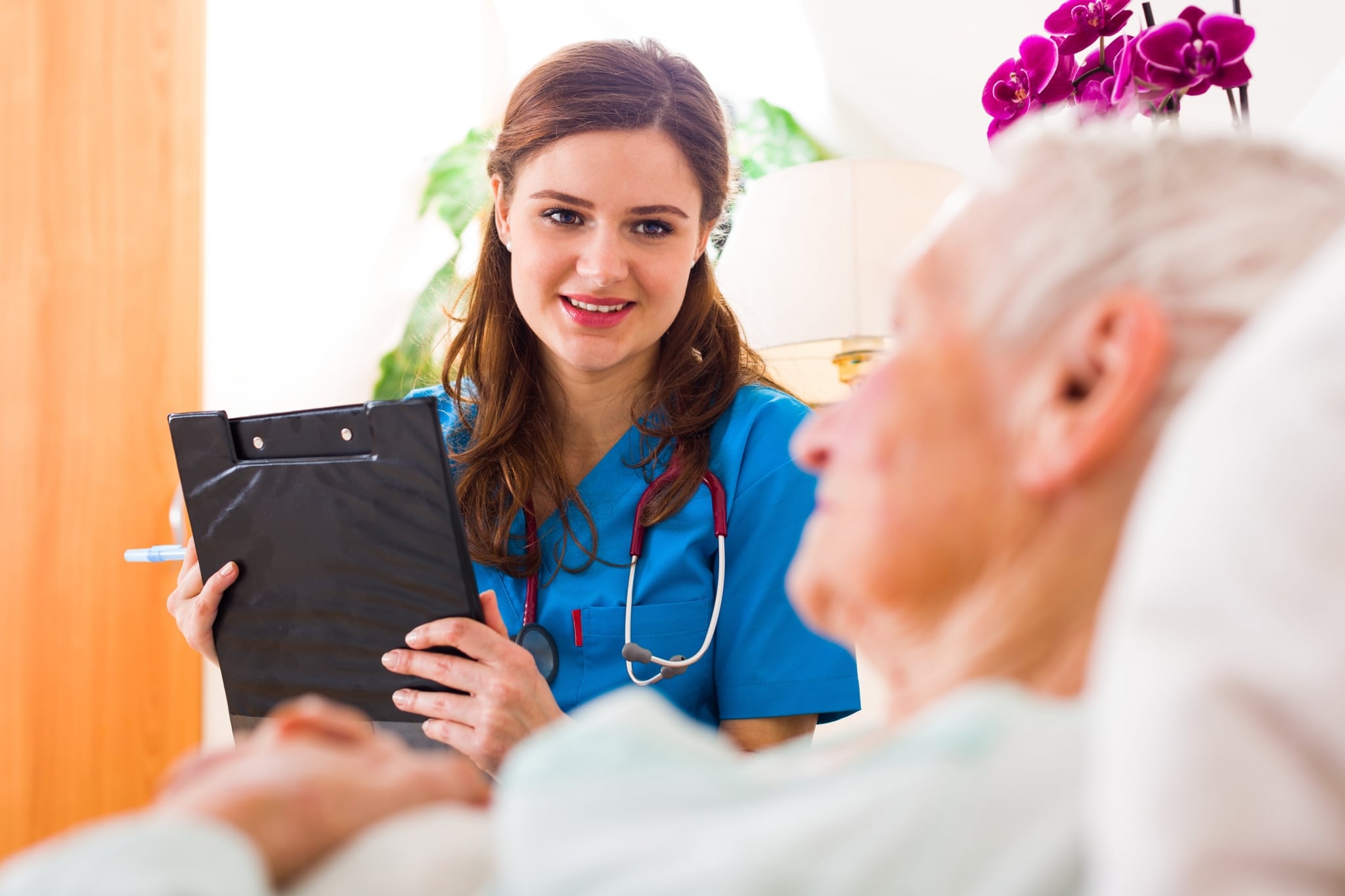 Kind nurse with a clipboard