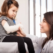 Female nurse with a pediatric patient