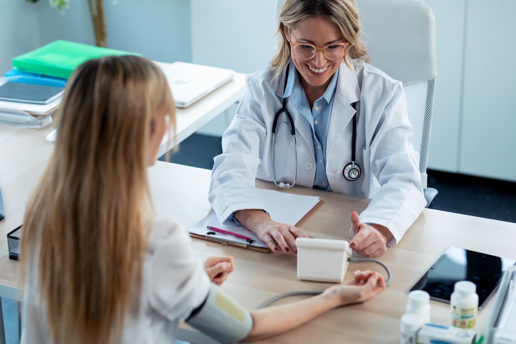 Healthcare professional taking vital signs