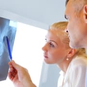 Two Orthopedic Nurse Practitioners Examining X-rays