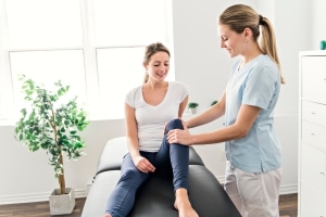 Physical Therapist Assistant with a female patient