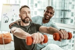 Physical Therapist Assistant with a male patient