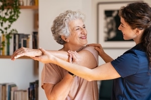 Physical Therapist Assistant with an elderly patient