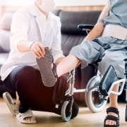 Physical Therapist Assistant manipulating a man's foot