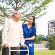 Physical Therapist Assistant outside with a patient