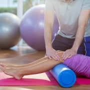 Physical Therapist Assistant manipulating a patient's legs