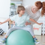 Physical Therapist Assistant with a child patient