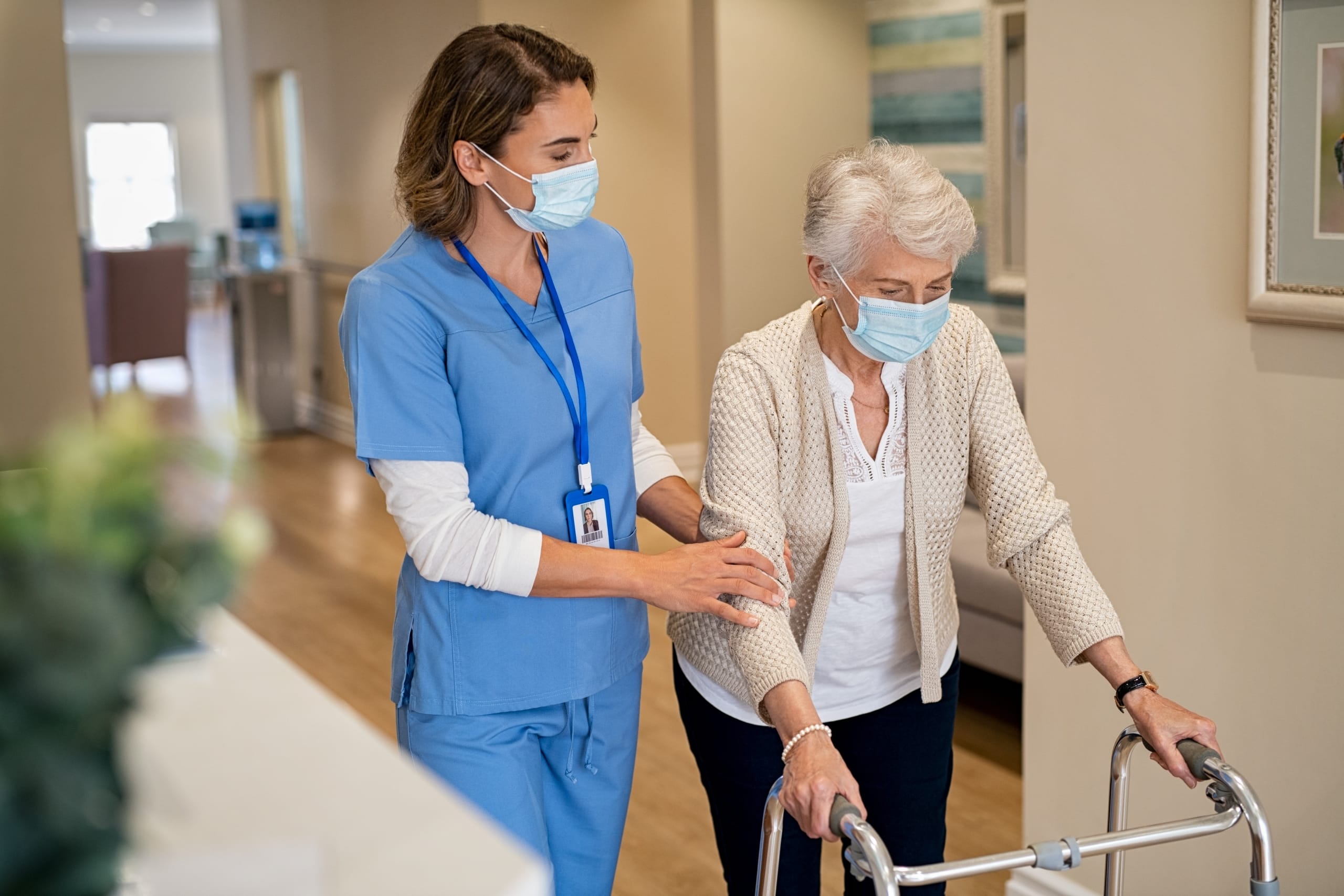 Female nurse helping an elderly patient