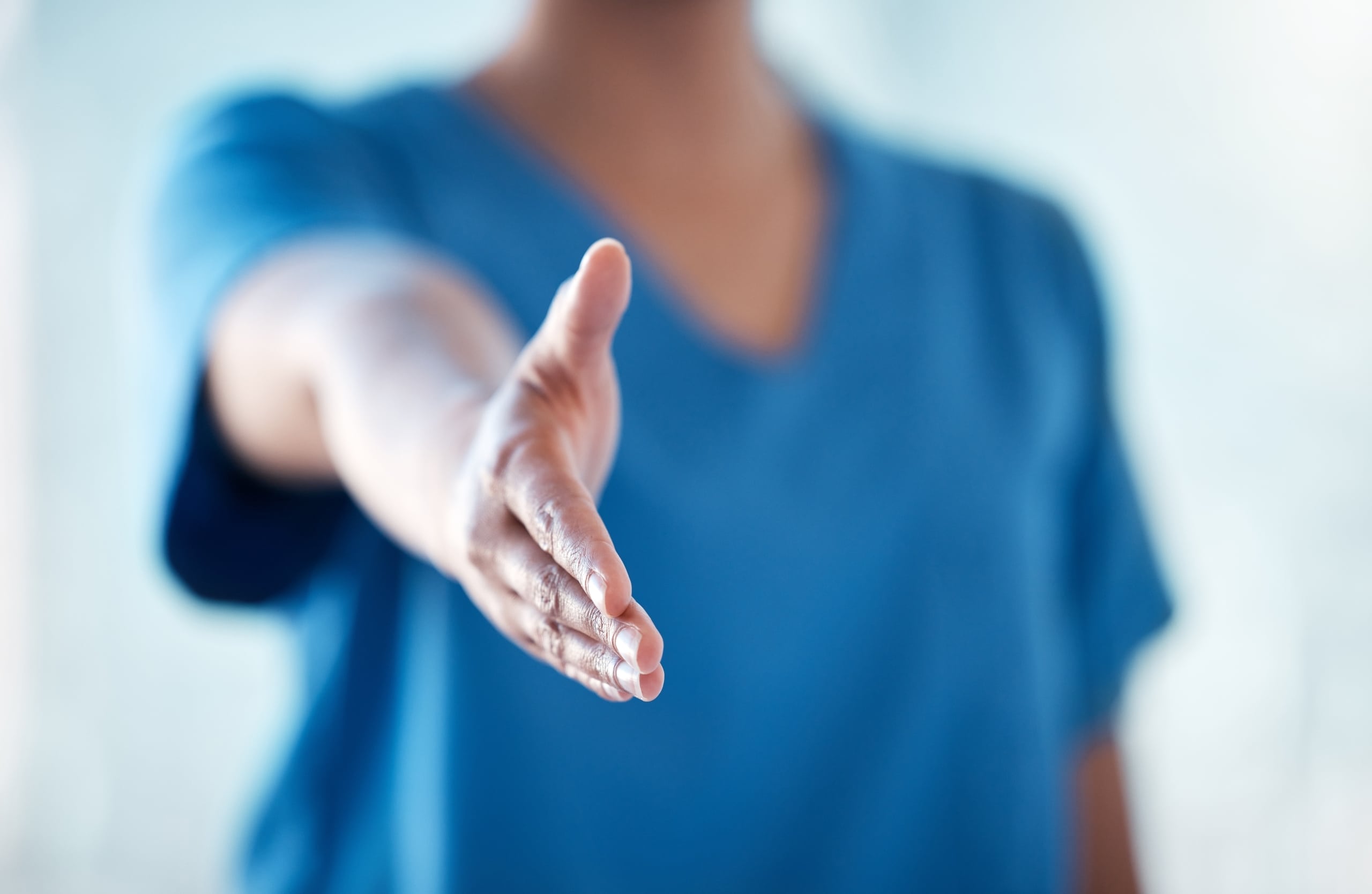 Nurse holding out their hand