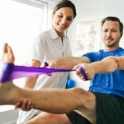 Physical therapy session with a patient using a band