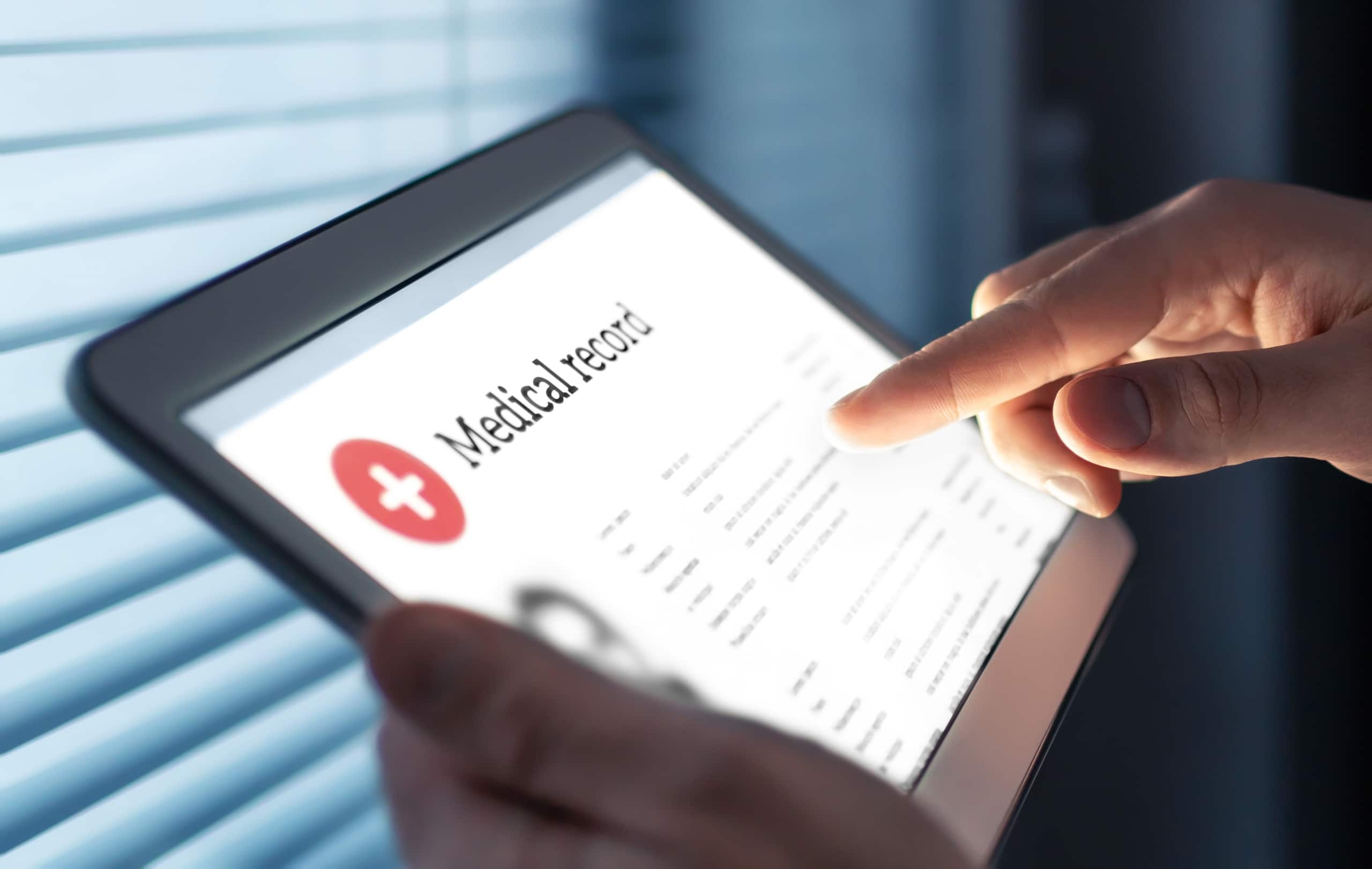 Close up of a tablet that says medical record