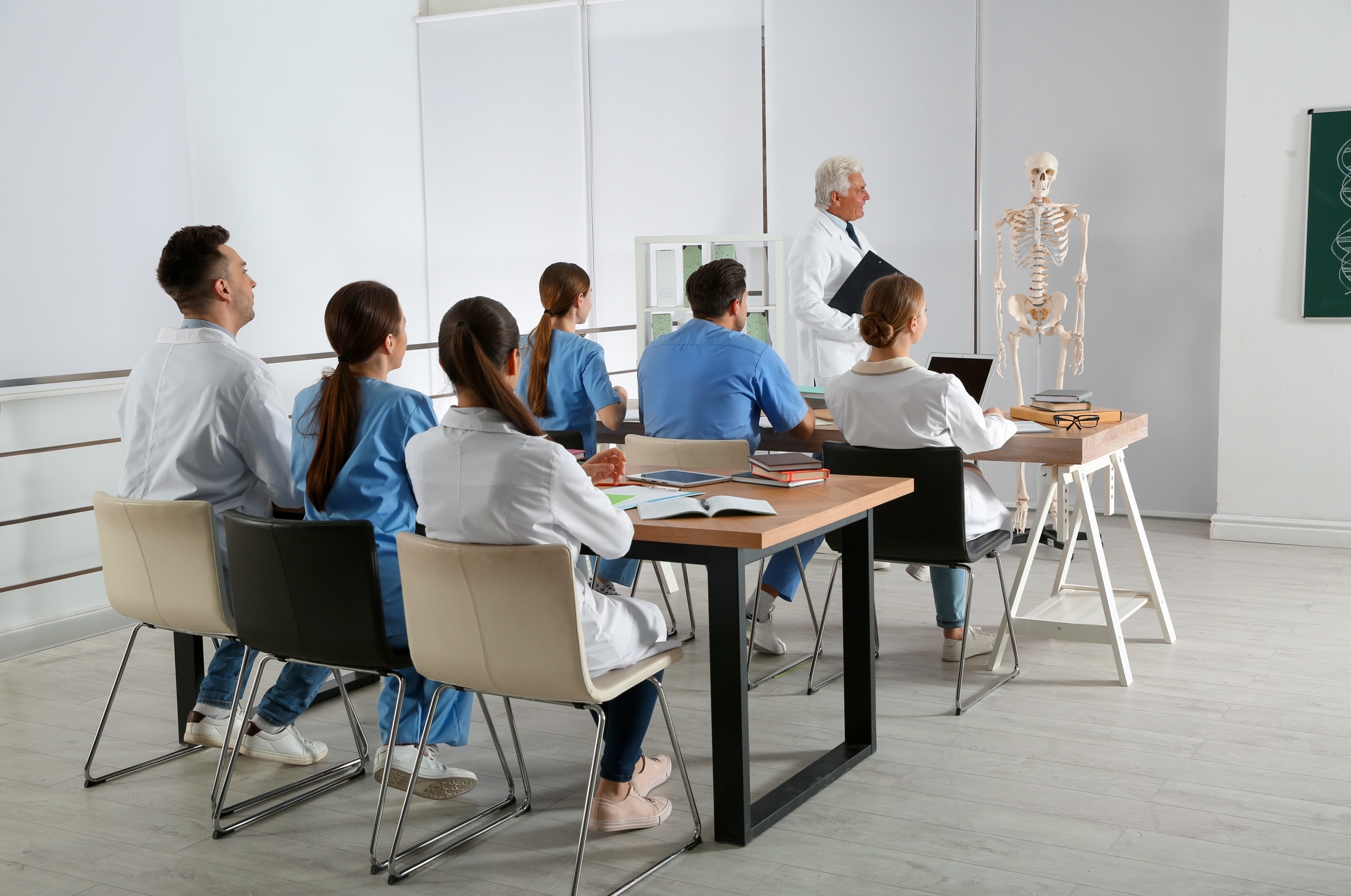 Group of medical students facing their instructor