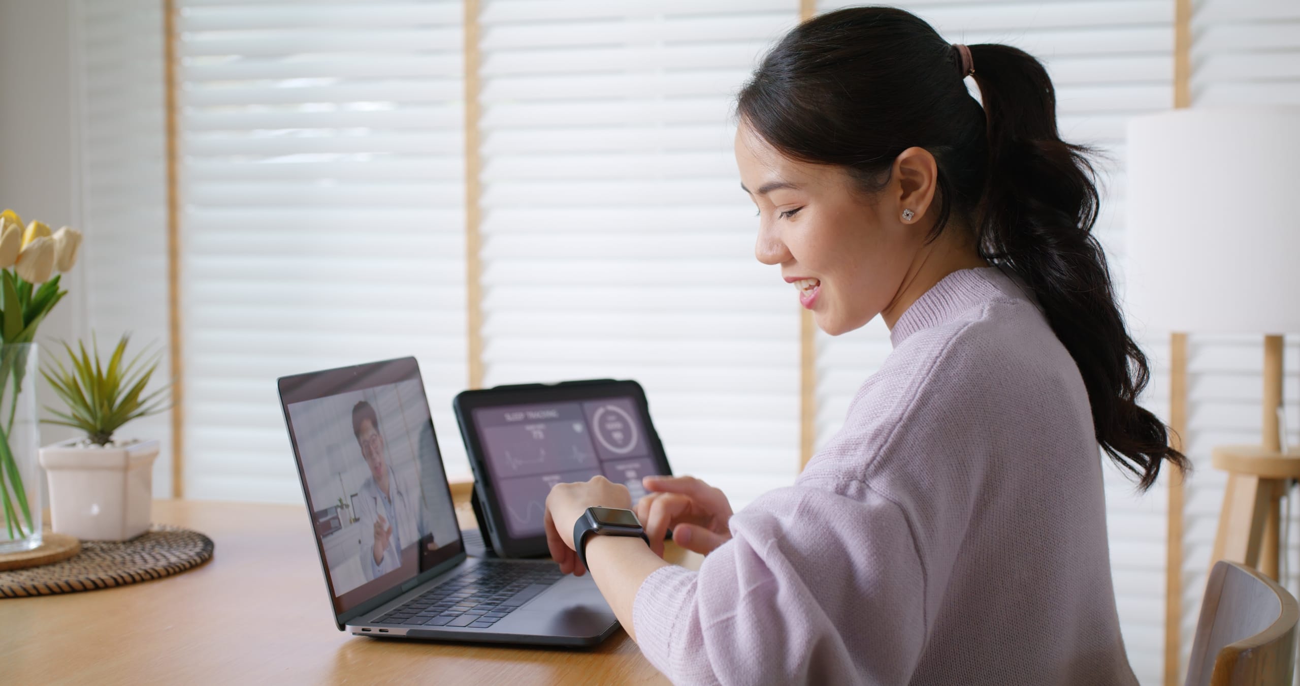 Asian woman in a telehealth call with her doctor