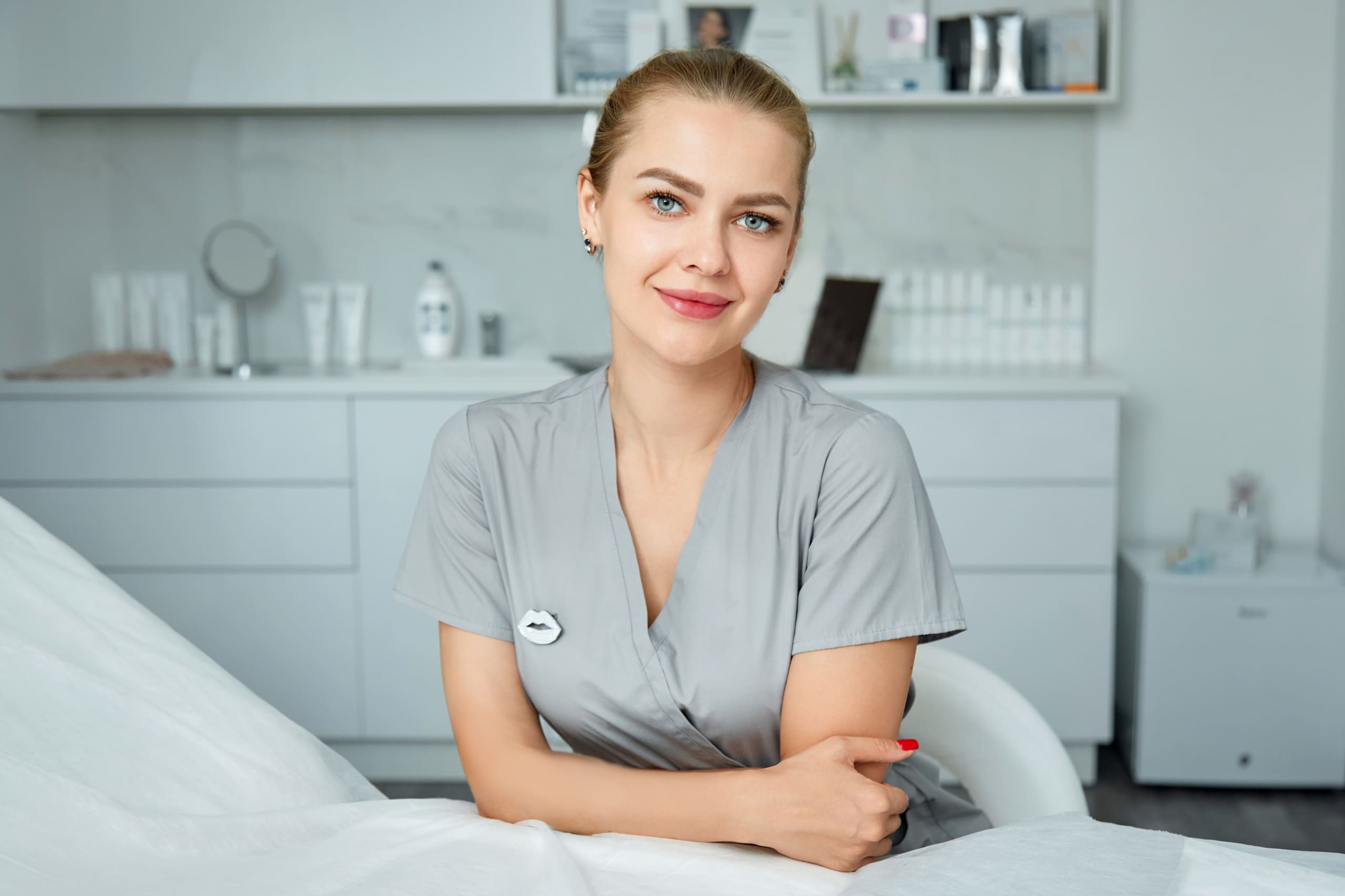 Young beautiful aesthetic nurse in an exam room